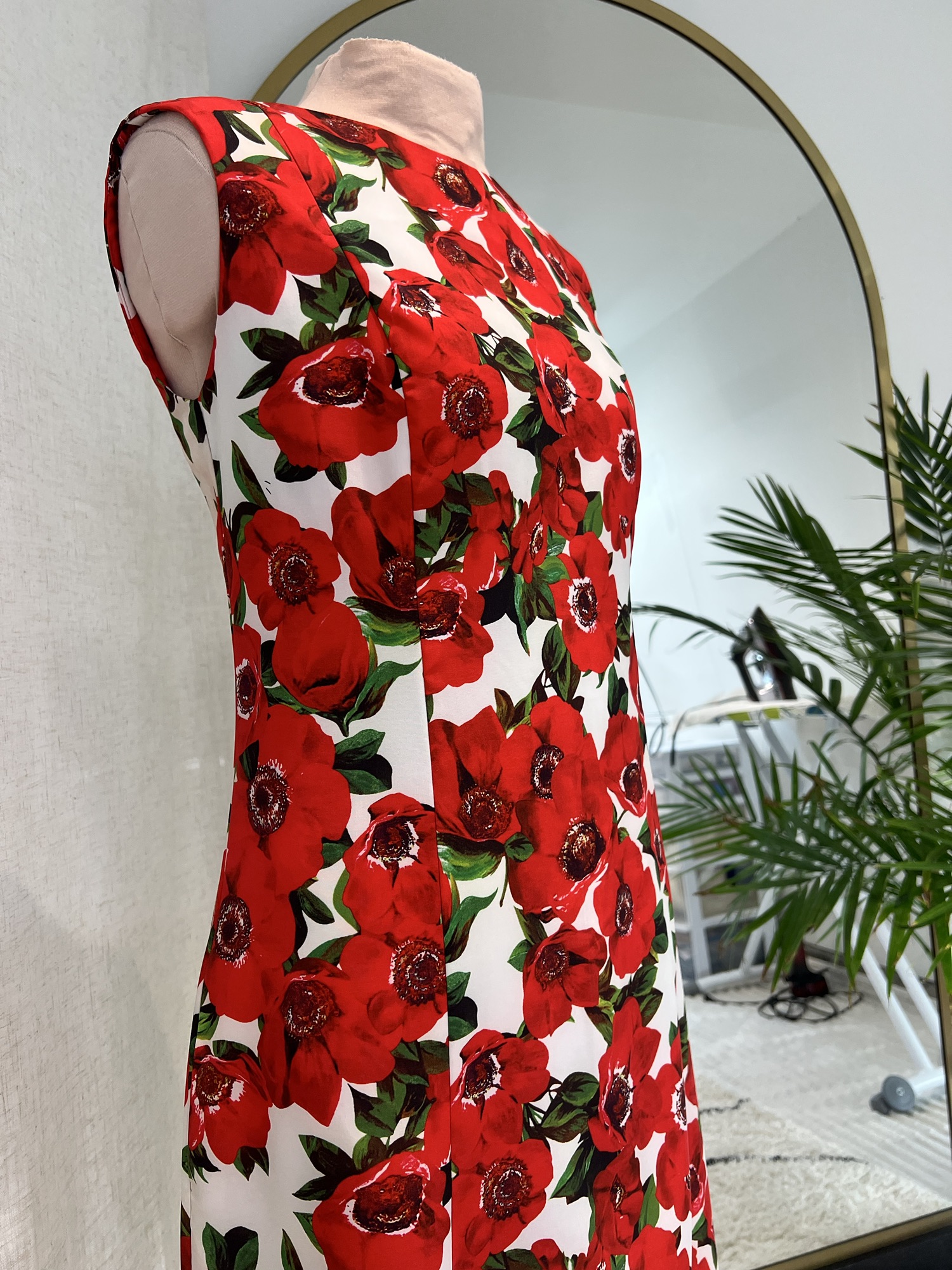 Red poppy print custom dress on a dress form